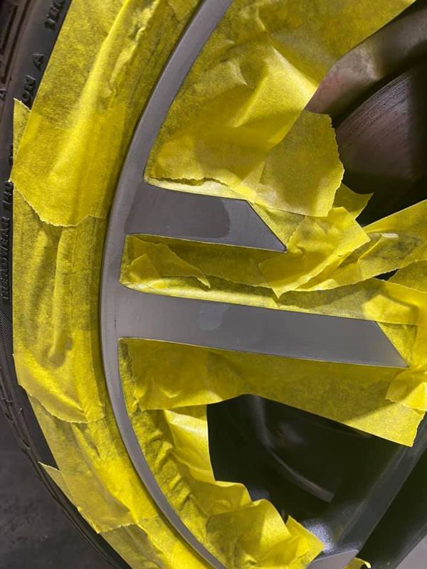 Audi wheel all masked ready to repair and paint