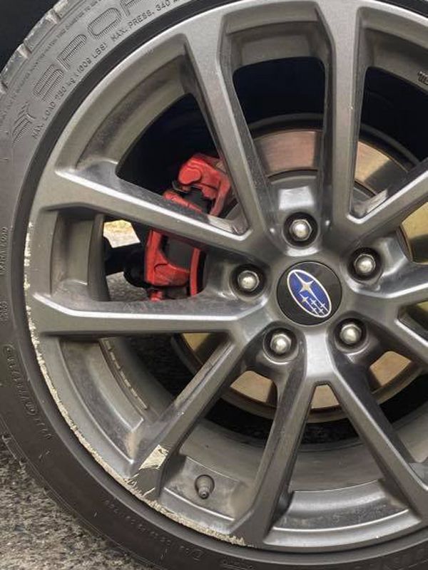Damaged Subaru Wheel with Gutter Rash